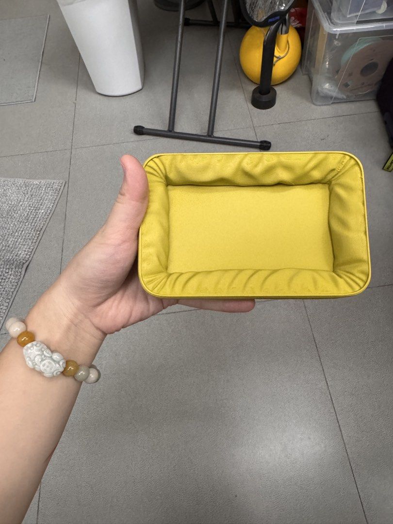 Yellow Rectangular Padded Storage Tray (Category: Storage Boxes & Baskets) located in Quezon City. Submitted by wilstockpile (Listing ID 1464579874, Image 2). Description: - Adorable yellow tray with a rectangular shape. - Features padded sides for a soft touch. - Ideal for organizing small items like keys, coins, or jewelry. - Bright, cheerful yellow color adds a pop of fun. - Easy to clean and maintain..