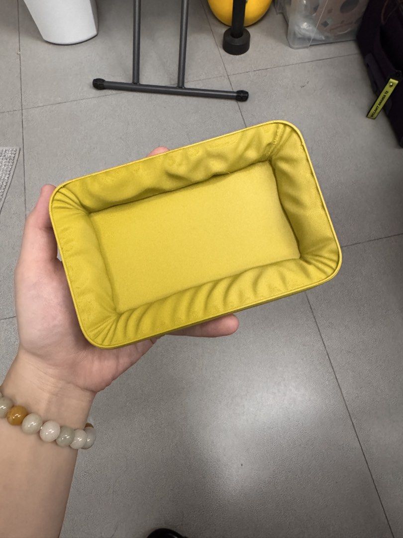 Yellow Rectangular Padded Storage Tray (Category: Storage Boxes & Baskets) located in Quezon City. Submitted by wilstockpile (Listing ID 1464579874, Image 1). Description: - Adorable yellow tray with a rectangular shape. - Features padded sides for a soft touch. - Ideal for organizing small items like keys, coins, or jewelry. - Bright, cheerful yellow color adds a pop of fun. - Easy to clean and maintain..