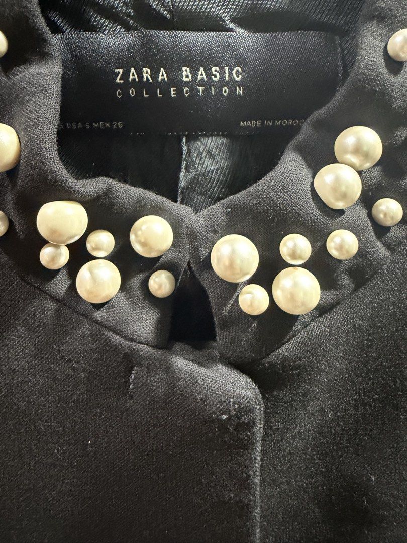 Zara Basic Collection Black Pearl Embellished Jacket (Category: Coats, Jackets and Outerwear) located in Quezon City. Submitted by lilybeth_42 (Listing ID 1464599245, Image 2). Description: - Zara Basic black jacket - Elegant pearl embellishments on collar and pocket details - bit tarnish - Classic button-front closure - Estimated size S - Versatile piece to dress up any outfit.