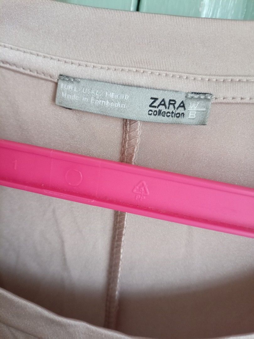 ZARA Collection Oversized T-shirt (Category: Shirts) located in Makati City. Submitted by meowmyella (Listing ID 1464617136, Image 2). Description: - Oversized t-shirt from Zara Collection B - Color: Light pinkish-beige - Relaxed fit for ultimate comfort - Ideal for casual wear - Versatile and easy to style.