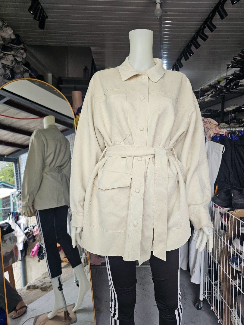 Zara Cream Belted Utility Jacket (Category: Coats, Jackets and Outerwear) located in Baguio. Submitted by kayeonlineshop (Listing ID 1464659401, Image 1). Description: - ZARA utility shirt-jacket (shacket) in a gorgeous cream / ivory tone. Crafted from a soft, brushed faux-suede fabric, this versatile piece features a classic collar, front snap-button closures, large functional chest and side pockets, and an adjustable matching fabric tie-belt to