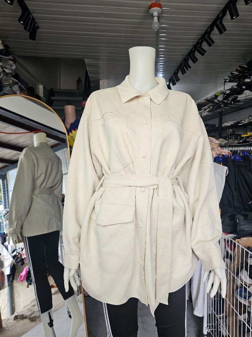 Zara Cream Belted Utility Jacket (Category: Coats, Jackets and Outerwear) located in Baguio. Submitted by kayeonlineshop (Listing ID 1464659401, Image 2). Description: - ZARA utility shirt-jacket (shacket) in a gorgeous cream / ivory tone. Crafted from a soft, brushed faux-suede fabric, this versatile piece features a classic collar, front snap-button closures, large functional chest and side pockets, and an adjustable matching fabric tie-belt to