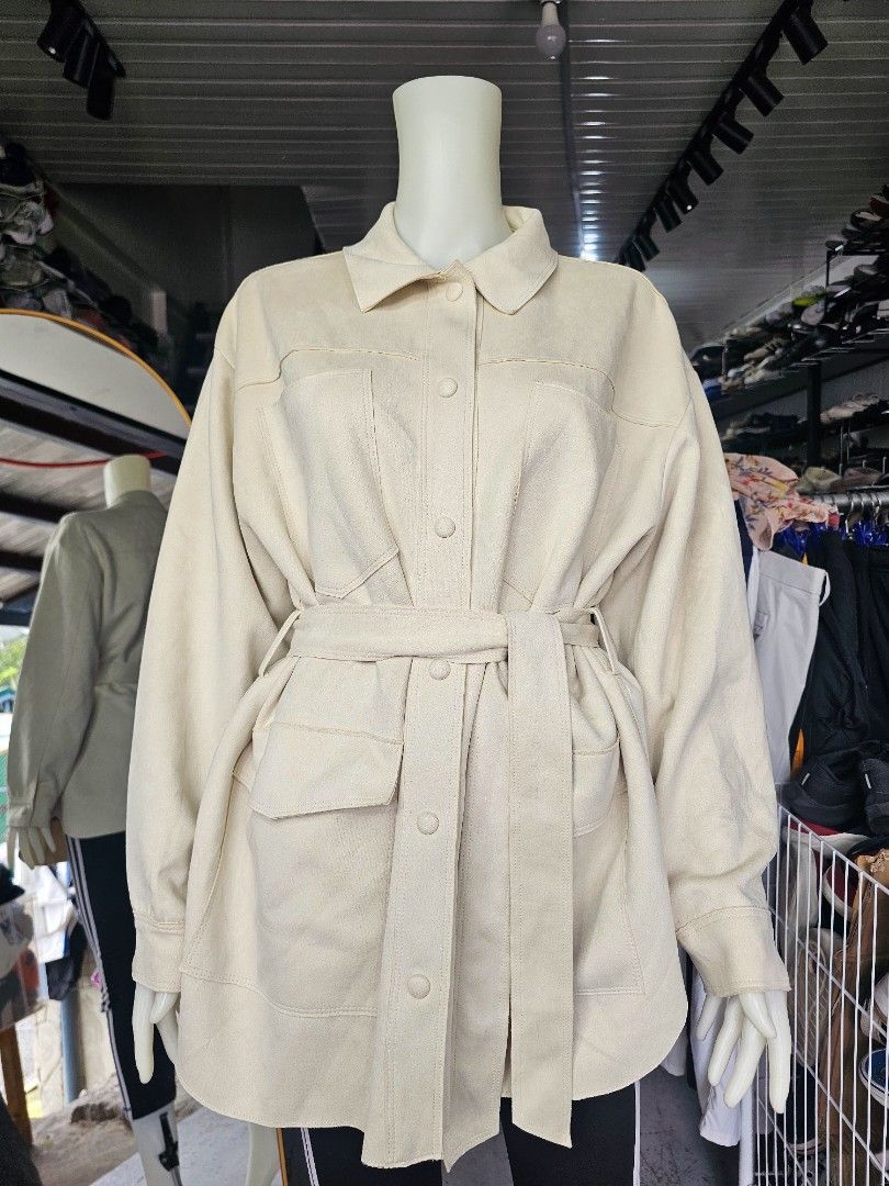 Zara Cream Belted Utility Jacket (Category: Coats, Jackets and Outerwear) located in Baguio. Submitted by kayeonlineshop (Listing ID 1464659401, Image 3). Description: - ZARA utility shirt-jacket (shacket) in a gorgeous cream / ivory tone. Crafted from a soft, brushed faux-suede fabric, this versatile piece features a classic collar, front snap-button closures, large functional chest and side pockets, and an adjustable matching fabric tie-belt to