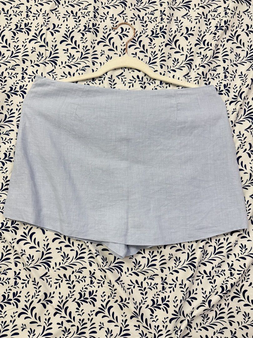 Zara Light Blue Linen Skort Size M (Category: Shorts) located in Manila. Submitted by janelica220598 (Listing ID 1464726820, Image 2). Description: - Brand: Zara - Size: M (Made in Morocco) - Material: Linen blend, light and breezy for warm weather - Design: Front skirt flap with back shorts, side zipper closure - Style: Minimalist and easy to match with basic tops - Condition: Clean, worn only a few times.