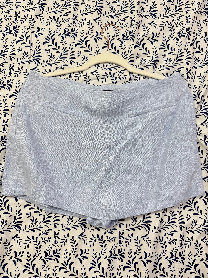 Zara Light Blue Linen Skort Size M (Category: Shorts) located in Manila. Submitted by janelica220598 (Listing ID 1464726820, Image 1). Description: - Brand: Zara - Size: M (Made in Morocco) - Material: Linen blend, light and breezy for warm weather - Design: Front skirt flap with back shorts, side zipper closure - Style: Minimalist and easy to match with basic tops - Condition: Clean, worn only a few times.