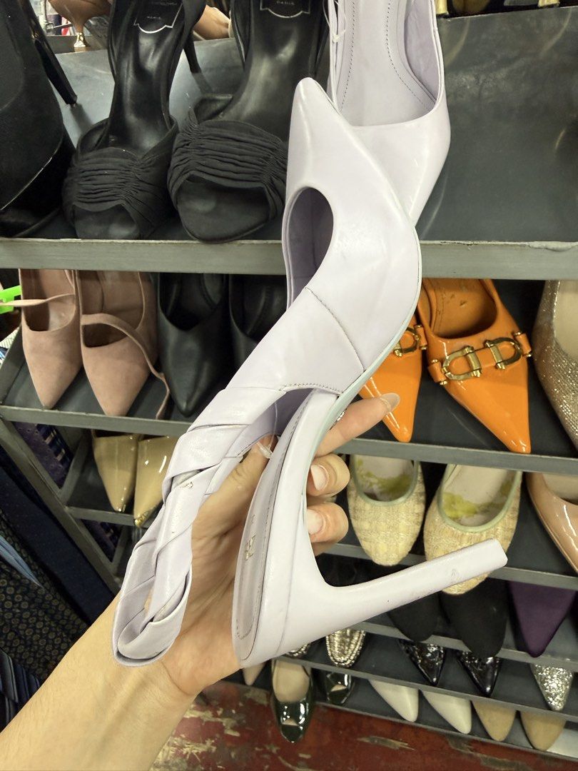 Zara Lilac Pointed Toe Slingback Heels Size 38 (Category: Heels) located in Manila. Submitted by fastlion.584bdf (Listing ID 1464737934, Image 3). Description: - Brand: Zara - Style: Lilac slingback heels with pointy toes and twisted back strap - Heel: High block heel - Size: 38 (stamped on sole) - Flaws: Scuff mark near the front toe area; bottom heel tip missing on one shoe (inner core exposed) - Condition: Sold as-is.