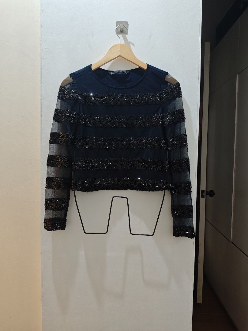 Zara Navy Sequin Mesh Long Sleeve Top (Category: Longsleeves) located in Quezon City. Submitted by bushia.preloved (Listing ID 1464661315, Image 2). Description: - Navy long sleeve top from Trafaluc - Horizontal sequin embellishments on front and sleeves - Sheer mesh fabric on sleeves - Fits XS to Medium Loc South Triangle, QC - Shipping via lalamove, grab or j&t Mode of payment via gcash or bdo #prelovedclothesph #ootdph.