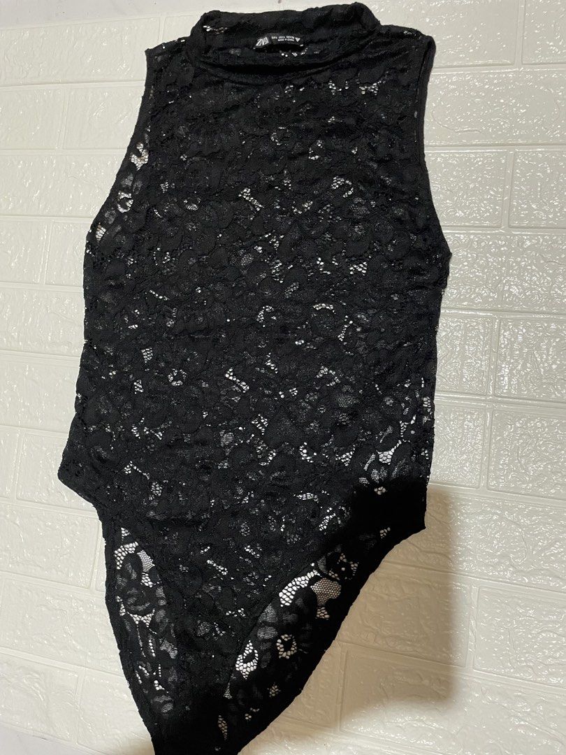 Zara Lace Mock Neck Bodysuit (Category: Sleeveless) located in Marilao. Submitted by clear_out_closet (Listing ID 1464626266, Image 2). Description: Item Details: 👇 • Brand: Zara • Color: Black • Material: 92% Polyamide (Nylon), 8% Elastane • Country of Origin: Made in China • Sizing: EUR L / USA L / MEX 30 • Original Retail Price (SRP): ₱1,795 • Condition Note: Pre-loved in excellent condition with delicate floral lace fabric, high mock necklin