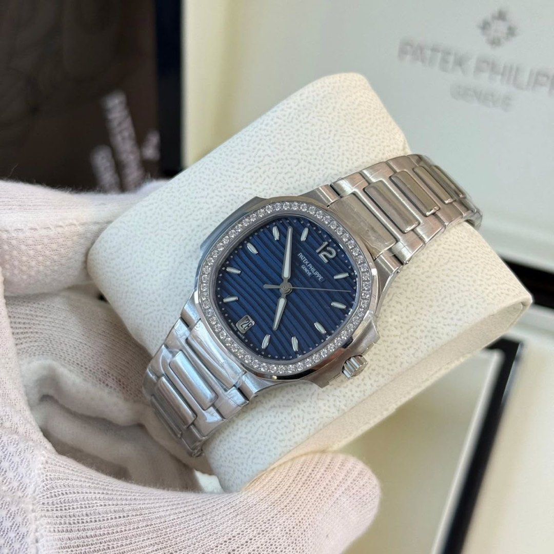 2026 Patek Philippe 7118/1200A-001 (Category: Watches) located in Singapore. Submitted by miraculousfight (Listing ID 1464885489, Image 3). Description: Watch Details • Brand: Patek Philippe • Reference: 7118/1200A-001 • Year: 2026 • Condition: Brand New / Never Worn • Dial: Blue Opaline • Case Material: Stainless Steel • Case Size: 35.2mm • Bezel: Original factory-set diamond bezel • Bracelet: Full links / complete bracelet • Box: Original Patek