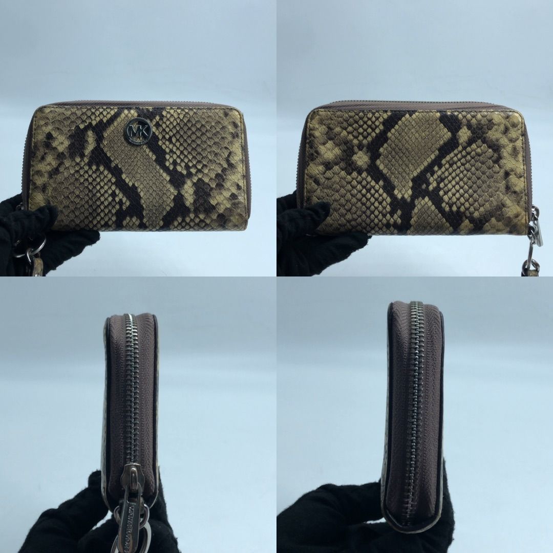 267007340 MICHAEL KORS WALLET SET WRISTLET YELLOW AND BLACK PYTHON-PATTERNED LEATHER (Category: Luxury Bags & Wallets) located in Taguig. Submitted by ecoring.ph (Listing ID 1464781759, Image 2). Description: ◆CONDITION: B ◆DESCRIPTIONS: (Other defects/info:) OUTER: The body of the wallet is scratched, scuffed, stained, and dirty, has press marks, and shows signs of use. The bottom corners and edges of the wallet are scratched, scuffed, stained, 