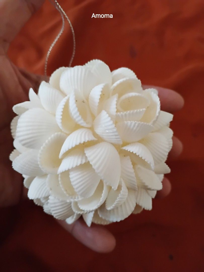 3.5in Seashell Ball Ornament Hanging Decor (Category: Artificial Plants & Flowers) located in Taguig. Submitted by amomaenterprise (Listing ID 1464817333, Image 3). Description: - handcrafted decorative balls made from white seashells - Features a delicate floral pattern arrangement - Includes a silver string loop for easy hanging - Each piece is individually wrapped in plastic packaging - Ideal for coastal-themed home decor, holiday ornaments, o