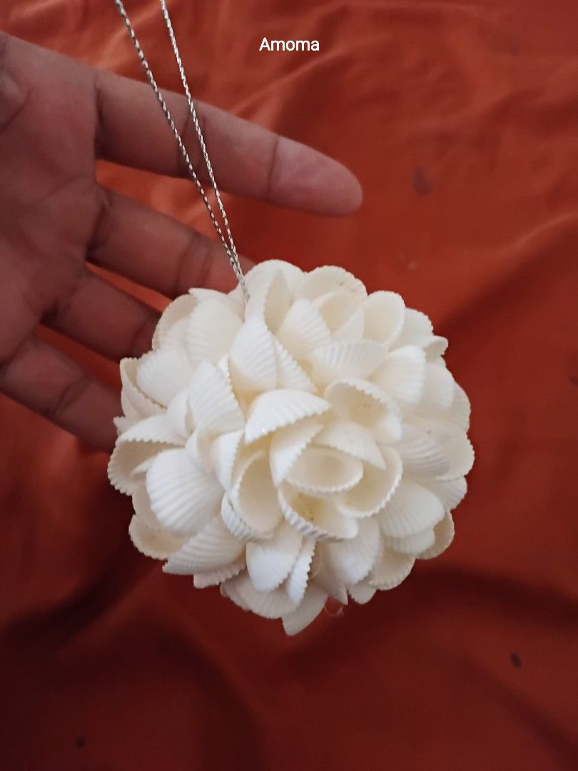 3.5in Seashell Ball Ornament Hanging Decor (Category: Artificial Plants & Flowers) located in Taguig. Submitted by amomaenterprise (Listing ID 1464817333, Image 1). Description: - handcrafted decorative balls made from white seashells - Features a delicate floral pattern arrangement - Includes a silver string loop for easy hanging - Each piece is individually wrapped in plastic packaging - Ideal for coastal-themed home decor, holiday ornaments, o