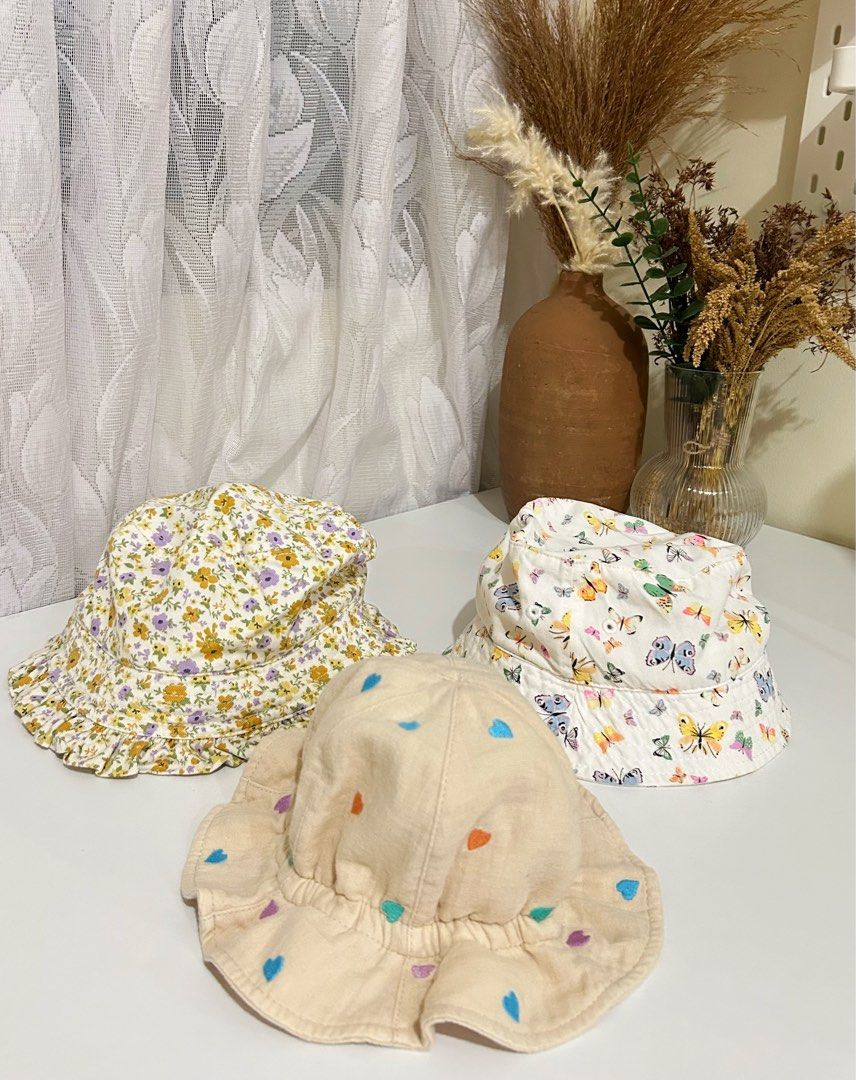 3-Piece Girls’ Bucket Hat Bundle (Category: Babies & Kids Fashion) located in Manila. Submitted by maison_marie (Listing ID 1464907190, Image 1). Description: Bundle of 3. Authentic. Bought in Canada Brands: H&M & Breeze 3 bucket hats. Floral print with ruffled brim. Colorful butterfly print. Cream with colorful heart prints and ruffled brim Cute and easy to pair with different outfits. Washed and ready to wear. Location: Malate, Manila Available