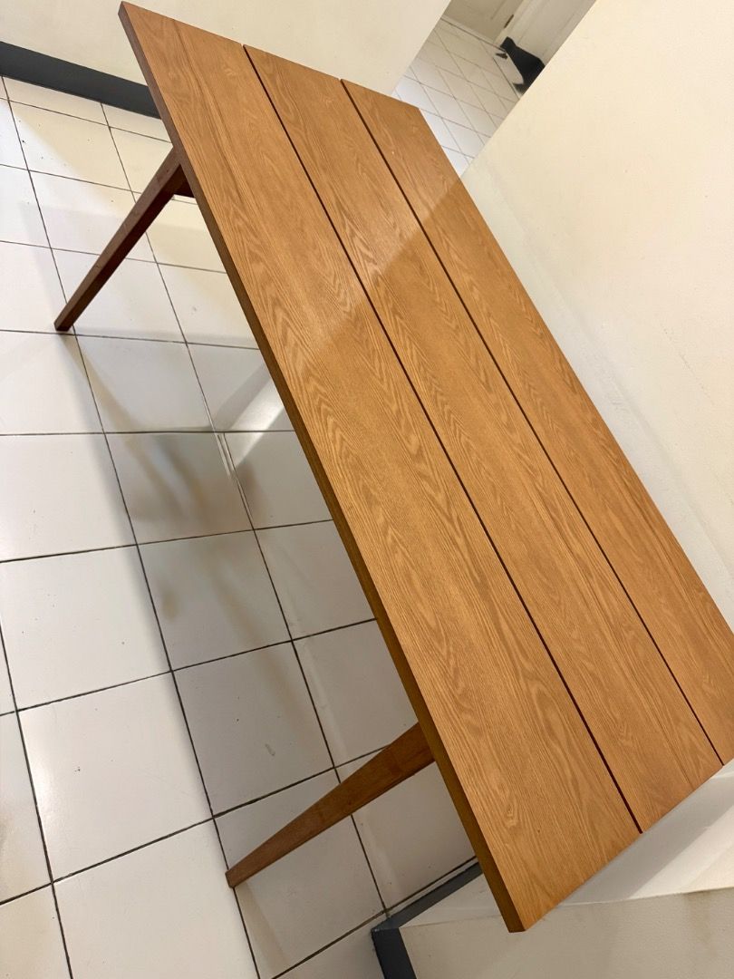 3-plank Wooden Dining Table (Category: Tables & Sets) located in Manila. Submitted by momobichon (Listing ID 1464806008, Image 1). Description: Beautiful 3-plank dining table with rich, natural oak grain and a warm honey finish. The slatted top gives it a modern farmhouse / Scandinavian look, and the angled, tapered legs add a clean mid-century touch. It seats 4 comfortably (6 in a pinch), and also works well as a work desk or a statement piece i