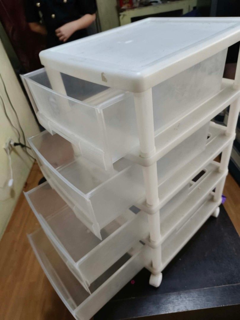 4-tier plastic storage drawer unit with wheels (Category: Storage Boxes & Baskets) located in Caloocan City. Submitted by gemmareas571129 (Listing ID 1464788859, Image 1). Description: - 4-tier stackable pull-out drawers for organizing clothes, stationery, or accessories - Durable white frame with semi-transparent drawers for easy visibility - Equipped with smooth-rolling wheels for effortless mobility - Flat top surface provides extra space for 