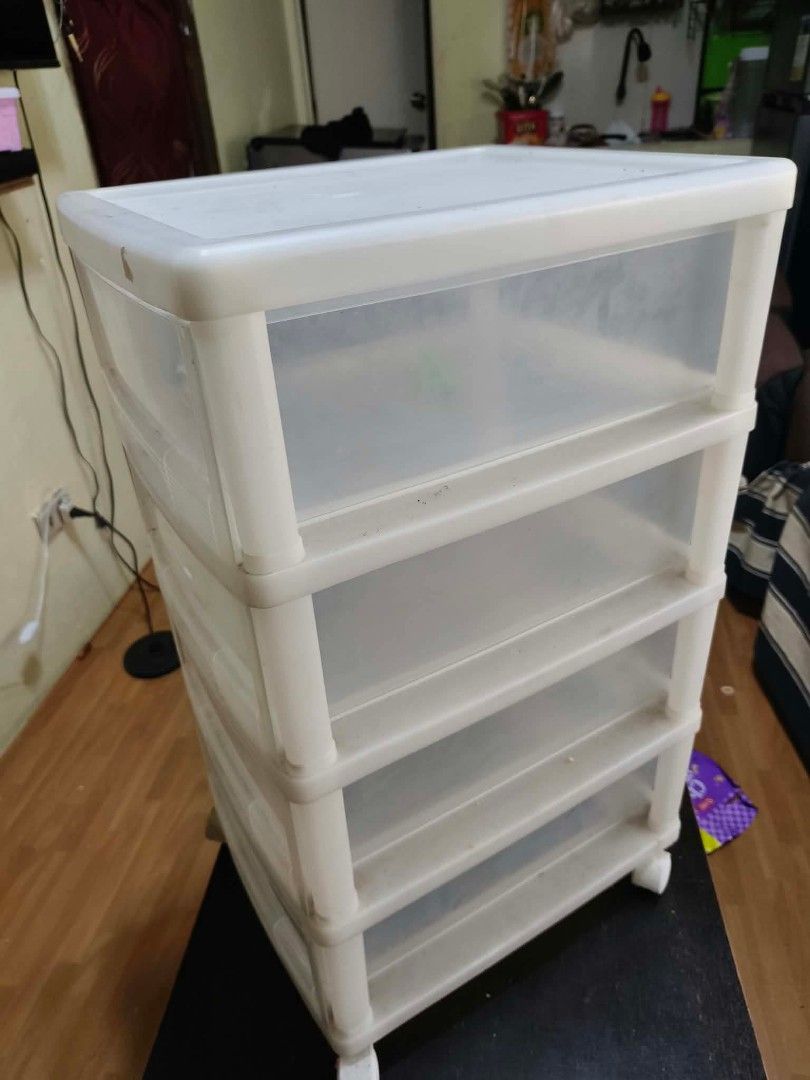 4-tier plastic storage drawer unit with wheels (Category: Storage Boxes & Baskets) located in Caloocan City. Submitted by gemmareas571129 (Listing ID 1464788859, Image 3). Description: - 4-tier stackable pull-out drawers for organizing clothes, stationery, or accessories - Durable white frame with semi-transparent drawers for easy visibility - Equipped with smooth-rolling wheels for effortless mobility - Flat top surface provides extra space for 