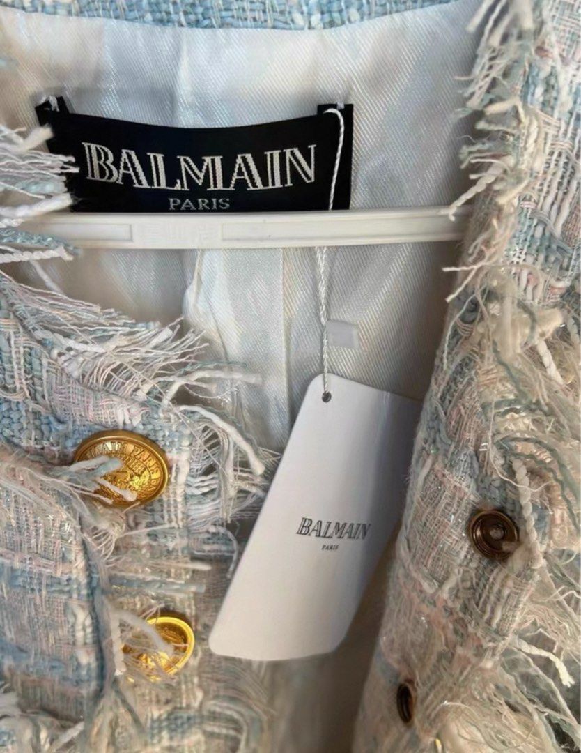 5#85 Balmain Tweed Jacket size M balman (Category: Coats, Jackets and Outerwear) located in Manila. Submitted by richru (Listing ID 1464922181, Image 3). Description: - Authentic Balmain tweed jacket in light blue, pink, and white plaid - Brand new with original hanging tag still attached - Features iconic gold embossed buttons on the front and pockets - Chic frayed raw edges and fully lined in white fabric - Material: Cotton, acrylic, polyamide,