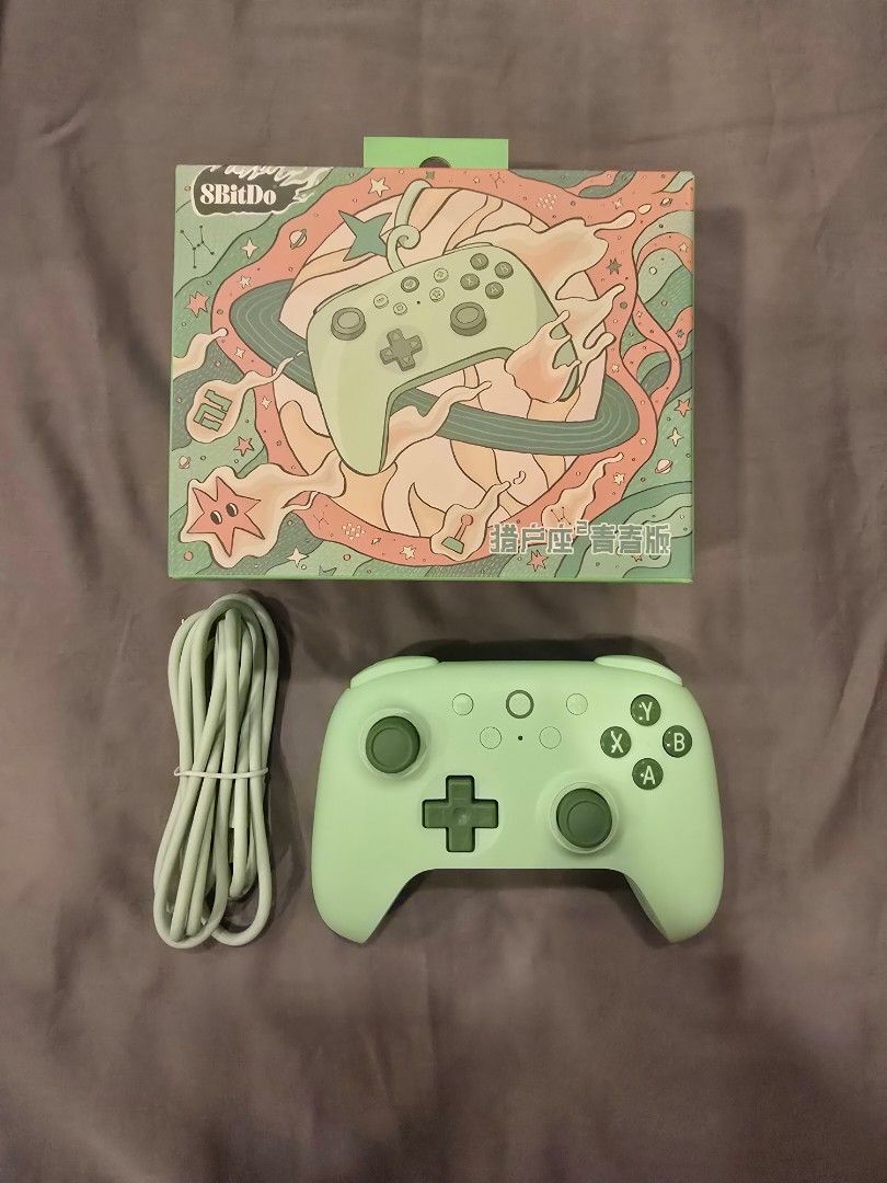 8BitDo Ultimate 2C Wired Controller (Category: Controllers) located in Singapore. Submitted by chapalang28 (Listing ID 1464863400, Image 3). Description: 🎮 8BitDo Green Wired Game Controller 🎮 Color: Mint Green 🟢 with sleek matte finish Price: S$20 (Usual: S$45) Condition: 10/10 — Barely used Great for PC / Steam gaming ✨ Features: - Wired (1.8m cable) - Ultra-low latency for responsive gameplay - High-precision joysticks - Vibration / haptic 