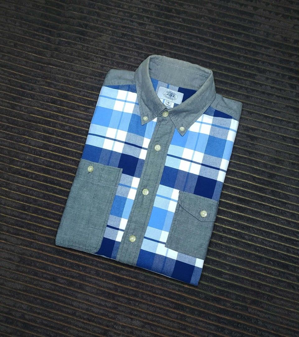A Bathing Ape BAPE Blue Plaid Patchwork Button-Up Shirt (Category: Tshirts & Polo Shirts ) located in Manila. Submitted by norathrifted (Listing ID 1464802043, Image 1). Description: - Brand: A Bathing Ape (BAPE) - Item: Blue plaid patchwork button-up shirt - Size: Medium (M) - Details: Blue/white check pattern with grey chambray sleeves, collar, and dual chest pockets - Unique Features: Plaid elbow patches, button-down collar, and signature BAPE