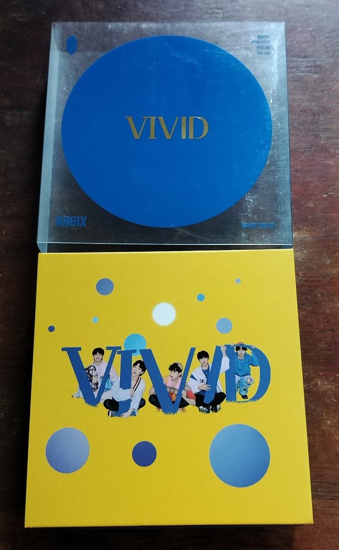 AB6IX 2nd EP VIVID Album V Version (Category: CDs & DVDs) located in Subic. Submitted by kalakal.sa.gapo (Listing ID 1464798289, Image 3). Description: - Album: AB6IX 2nd EP - VIVID (V Version) - Inclusions: Outer plastic sleeve, photobook, CD, photocards, and mini prints - Theme: Bright yellow and blue packaging - Rarity: Great addition to any ABNEW collection.