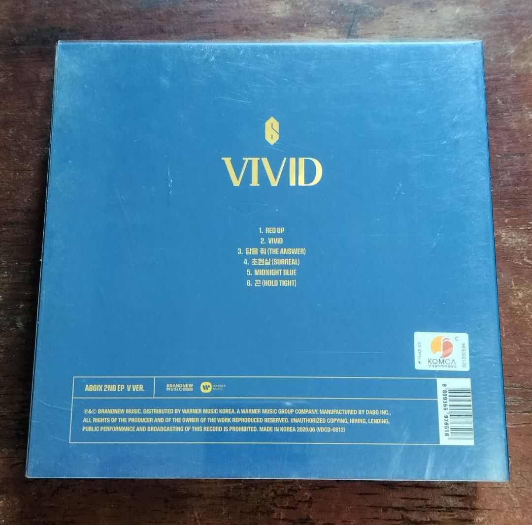 AB6IX 2nd EP VIVID Album V Version (Category: CDs & DVDs) located in Subic. Submitted by kalakal.sa.gapo (Listing ID 1464798289, Image 2). Description: - Album: AB6IX 2nd EP - VIVID (V Version) - Inclusions: Outer plastic sleeve, photobook, CD, photocards, and mini prints - Theme: Bright yellow and blue packaging - Rarity: Great addition to any ABNEW collection.