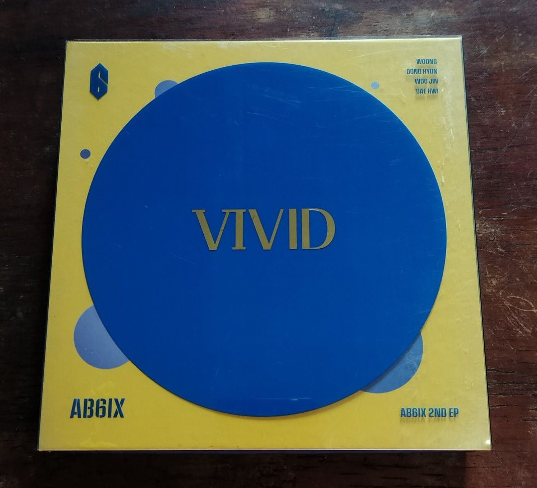 AB6IX 2nd EP VIVID Album V Version (Category: CDs & DVDs) located in Subic. Submitted by kalakal.sa.gapo (Listing ID 1464798289, Image 1). Description: - Album: AB6IX 2nd EP - VIVID (V Version) - Inclusions: Outer plastic sleeve, photobook, CD, photocards, and mini prints - Theme: Bright yellow and blue packaging - Rarity: Great addition to any ABNEW collection.