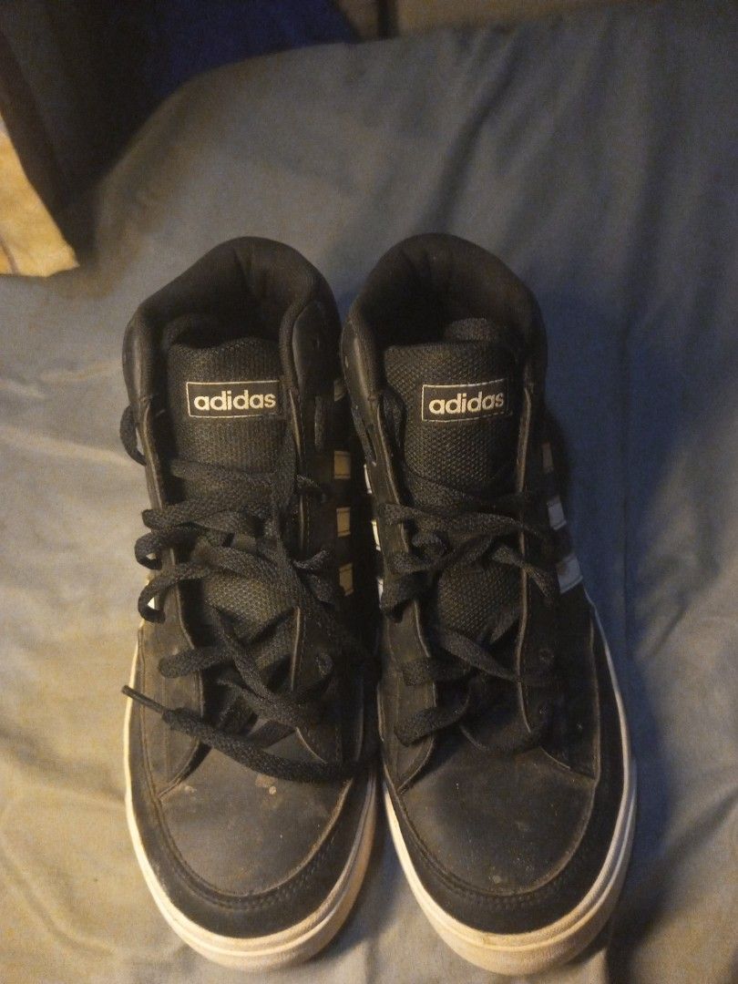 Adidas Black High Top Sneakers (Category: Casual Shoes) located in Manila. Submitted by ikomic20 (Listing ID 1464851910, Image 1). Description: - Brand: Adidas - Style: High-top sneakers - Color: Black with classic white stripes and black laces - Features: Padded ankle collar, three-stripes detail on back heel tab, size tag visible inside tongue - Condition: White rubber soles show light dirt from normal wear - Ready for a new home!.