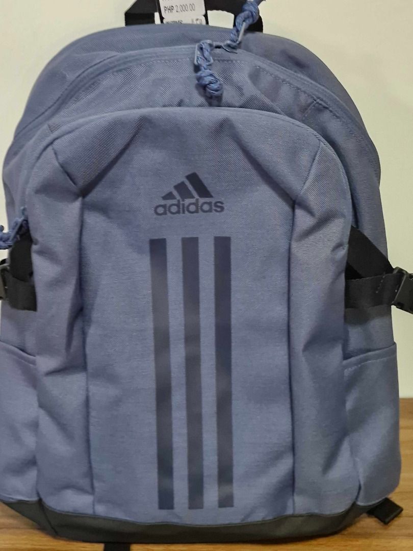 Adidas Blue Backpack (Category: Backpacks) located in Davao. Submitted by j_guitarist (Listing ID 1464967101, Image 1). Description: - 100% Authentic Adidas blue backpack with original tags attached (Price tag: PHP 2,000.00) - Stylish vertical three stripes design on the front - Multiple zippered compartments for organized storage - Side compression straps with durable buckles - Padded mesh back panel and shoulder straps for maximum daily comfort