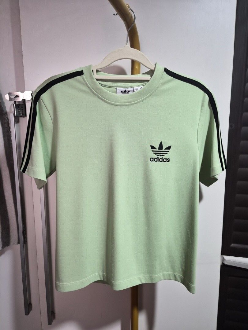 Adidas boxy T-shirts - Multiple Colors Available (Category: Shirts) located in Taguig. Submitted by chloe_clothingco. (Listing ID 1464389431, Image 3). Description: - Adidas Boxy T-shirts sizes Med -2XL - Available colors: Light Green, Black, Orange, Peach, White, Green, Purple - Features the iconic Adidas logo on each shirt - Ideal for casual everyday wear - Mix and match your favorite colors!.
