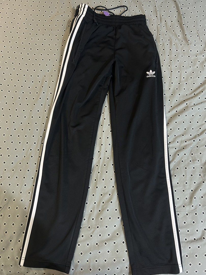 Adidas Firebird Trackpants (Category: Joggers) located in Makati City. Submitted by racarbon (Listing ID 1464826033, Image 1). Description: - Brand: Adidas Originals - Color: Black with white three-stripe side taping and trefoil logo - Size: S (fits true to size) - Material: Made with sustainable Parley Ocean Plastic - Features: Elastic adjustable drawstring waistband, side zipper pockets, and ankle zippers at the hems - Condition: Normal wear wi