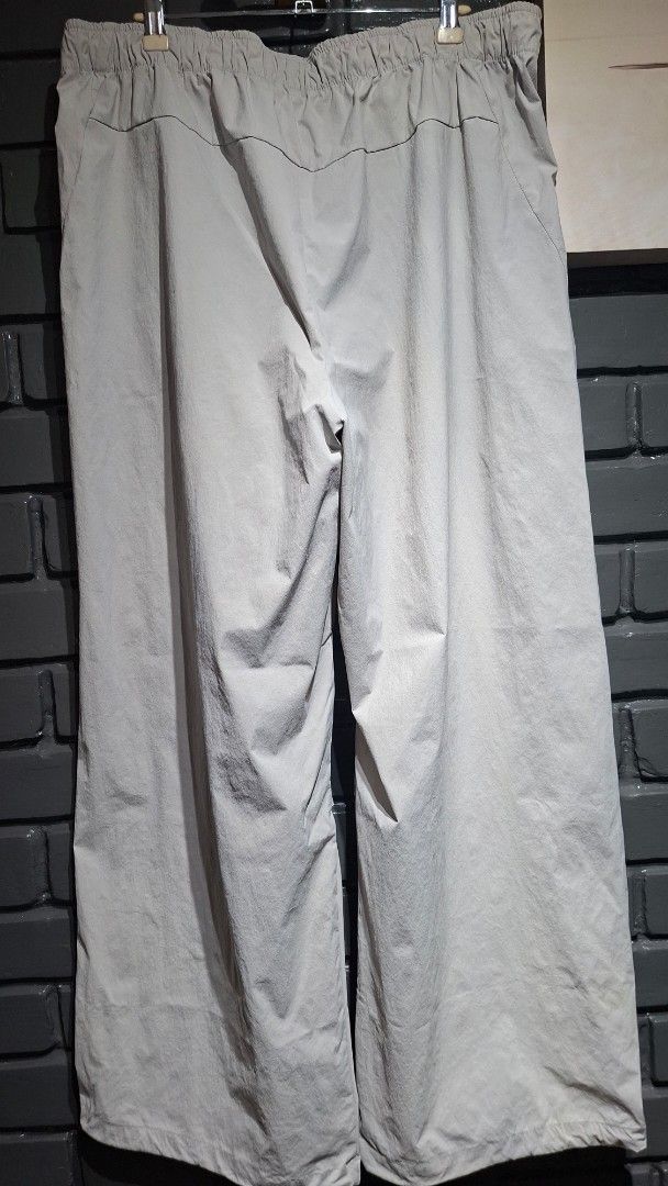 Adidas Grey Nylon Track Pants (Category: Joggers) located in Davao. Submitted by rodrigoani57168 (Listing ID 1464890084, Image 3). Description: - Brand: Adidas - Color: Light Grey - Material: Lightweight nylon - Waistband: Elastic with adjustable drawstring - Design: Classic Adidas logo near right hip, clean hem details - Fit: Relaxed fit - Ideal for: Workouts or casual streetwear - Adidas track pants - Size: 2XL -Color: Light Grey -Features Adid