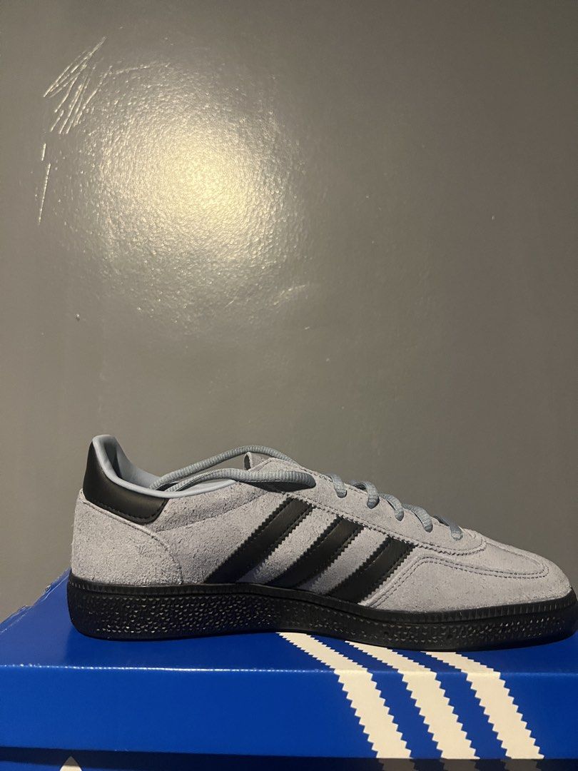 Adidas Handball Spezial (Category: Sneakers) located in Quezon City. Submitted by gymkhana103 (Listing ID 1464942810, Image 1). Description: - Model: Adidas Handball Spezial (Tacblu Cblack Goldmt) - Size: US 8 / UK 7.5 / EU 41 1/3 - Upper: Light blue suede with black leather three stripes and heel tab - Details: Signature gold foil Spezial branding on the side - Sole: Classic dark gum sole - Inclusion: Original blue Adidas box included.