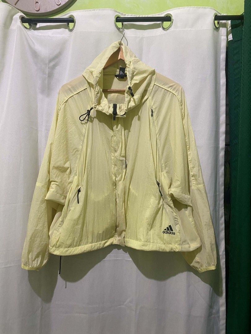 Adidas Light Yellow Windbreaker Jacket Size L (Category: Coats, Jackets and Outerwear) located in Quezon City. Submitted by elihur.tuazon (Listing ID 1464905331, Image 1). Description: - Brand: Adidas - Color: Light yellow - Size: A/L (170/92A) - Material: Lightweight nylon (easy to pack) - Design: Hooded with adjustable drawstrings, full zip closure - Pockets: Convenient zippered side pockets - Details: Elastic cuffs and brand logo printed on th