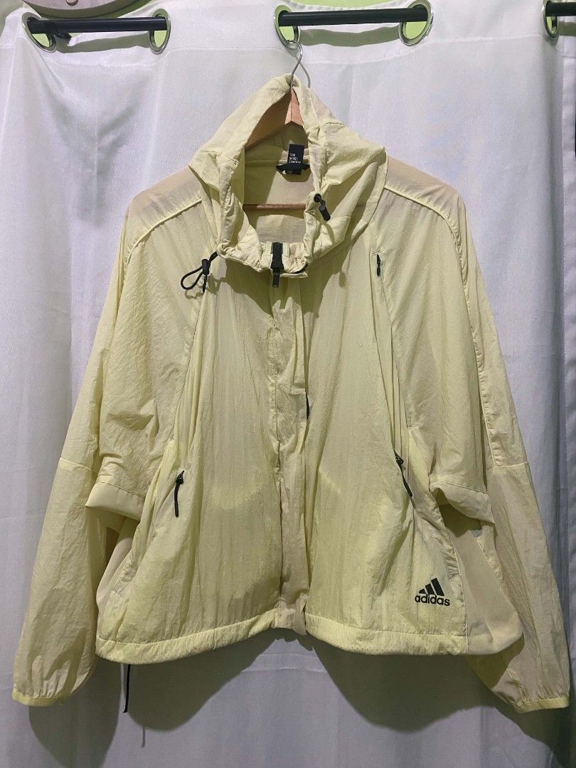Adidas Light Yellow Windbreaker Jacket Size L (Category: Coats, Jackets and Outerwear) located in Quezon City. Submitted by elihur.tuazon (Listing ID 1464905331, Image 2). Description: - Brand: Adidas - Color: Light yellow - Size: A/L (170/92A) - Material: Lightweight nylon (easy to pack) - Design: Hooded with adjustable drawstrings, full zip closure - Pockets: Convenient zippered side pockets - Details: Elastic cuffs and brand logo printed on th