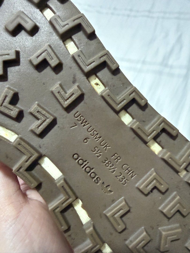 Adidas Retropy E5 Sneakers (Category: Sneakers) located in Quezon City. Submitted by jessyda (Listing ID 1464826643, Image 3). Description: - Model: Retro runner style in off-white suede and mesh with iconic dark blue three stripes - Sole: Classic brown gum rubber outsole with a cushioned midsole for all-day comfort - Size: US 7 / UK 5.5 / EUR 38 2/3 - Condition: Shows normal signs of wear on soles and uppers, giving it an awesome vintage look - 