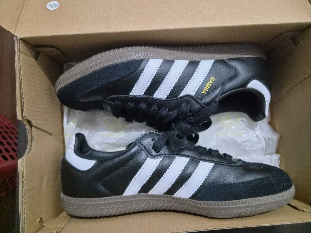 Adidas Samba OG Black White Gum Sole (Category: Sneakers) located in Cainta. Submitted by classic_chic (Listing ID 1458321104, Image 2). Description: - Classic Adidas Samba OG sneakers - Black leather upper with iconic white stripes - Durable gum sole for a retro aesthetic - 'SAMBA' branding on the side - Timeless and versatile for casual wear -never worn, brand new.
