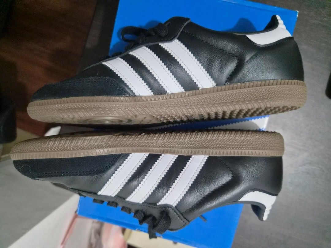Adidas Samba OG Black White Gum Sole (Category: Sneakers) located in Cainta. Submitted by classic_chic (Listing ID 1458321104, Image 3). Description: - Classic Adidas Samba OG sneakers - Black leather upper with iconic white stripes - Durable gum sole for a retro aesthetic - 'SAMBA' branding on the side - Timeless and versatile for casual wear -never worn, brand new.