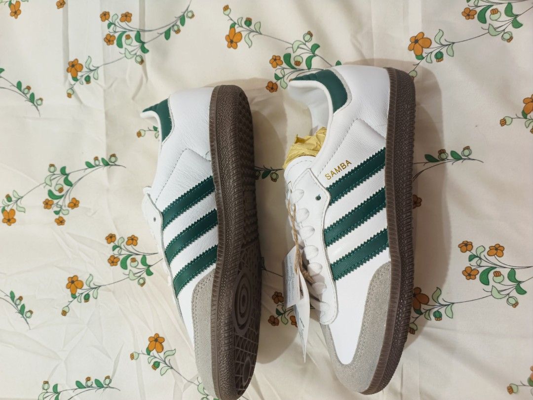 Adidas Samba White Green Sneakers (Category: Sneakers) located in Baguio. Submitted by maria.s0329822318 (Listing ID 1464785433, Image 2). Description: - Brand: Adidas Samba - Colorway: White and green with classic gum sole and suede toe overlay - Condition: Brand new, fresh out of the box with original tags and stuffing - Details: Iconic gold foil Samba lettering on the side, standard lace-up design - Style: Clean, versatile look that easily mat