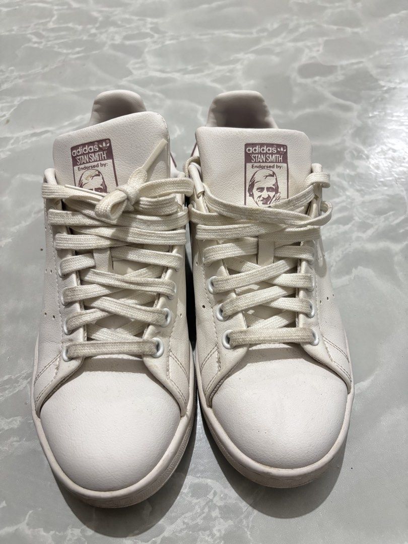Adidas Stan Smith Pink White Sneakers US 7 (Category: Sneakers) located in Manila. Submitted by amphitrite_ (Listing ID 1464780914, Image 1). Description: - Brand: Adidas Stan Smith - Color: White with Dusty Pink heel tabs and branding - Size: US 7 / UK 5.5 / FR 38 2/3 - Design: Classic low-top tennis shoe with perforated three stripes - Features: Pink insoles with 'end plastic waste' detail - Condition: Clean uppers with minimal wear on outsoles