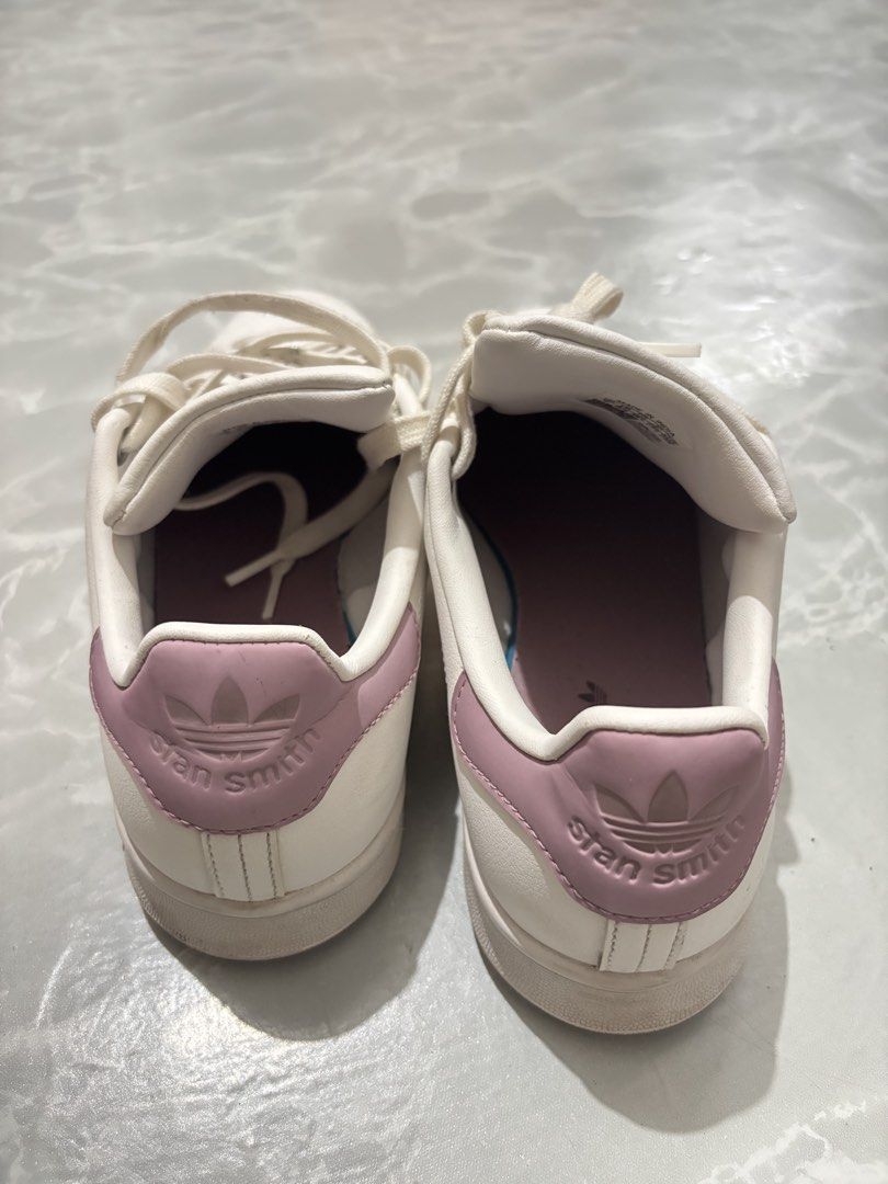 Adidas Stan Smith Pink White Sneakers US 7 (Category: Sneakers) located in Manila. Submitted by amphitrite_ (Listing ID 1464780914, Image 2). Description: - Brand: Adidas Stan Smith - Color: White with Dusty Pink heel tabs and branding - Size: US 7 / UK 5.5 / FR 38 2/3 - Design: Classic low-top tennis shoe with perforated three stripes - Features: Pink insoles with 'end plastic waste' detail - Condition: Clean uppers with minimal wear on outsoles