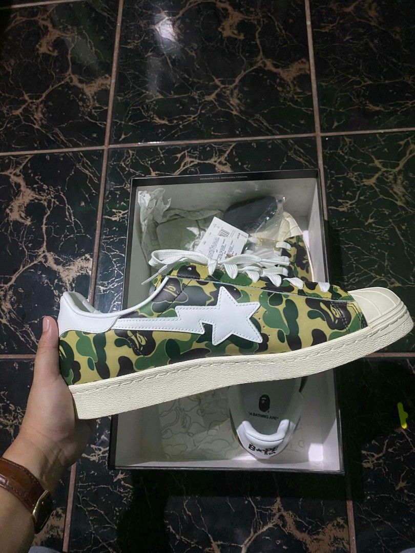 Adidas Superstar BAPE ABC Camo Green (Category: Sneakers) located in Quezon City. Submitted by ylang_ylang (Listing ID 1464900724, Image 1). Description: For sale only, not for swap. - 100% Authentic - Brand new, never used - Complete with: tags, receipt, extra laces, and original box - Crisp gold BAPE emblem as seen in photos - US 11.5 | UK 11 - Can send more photos upon request - Shipping fee c/o buyer - Payment via: GCash & bank transfer ‼️NEG