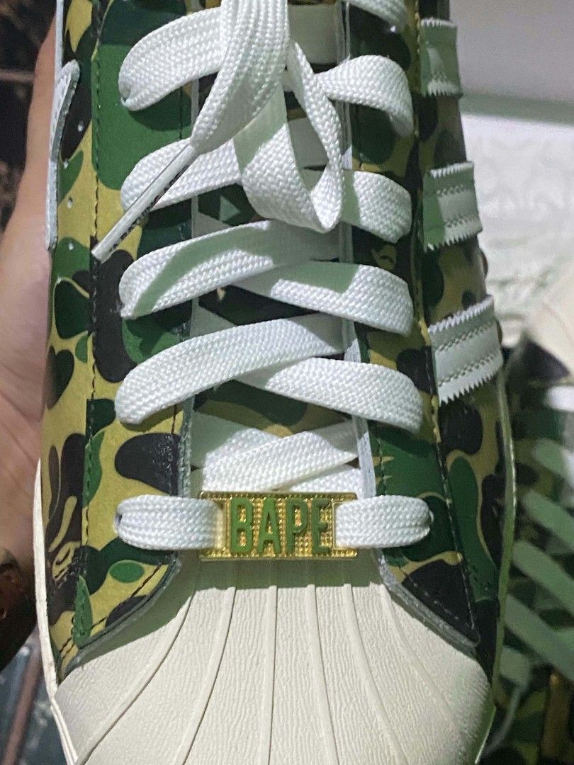 Adidas Superstar BAPE ABC Camo Green (Category: Sneakers) located in Quezon City. Submitted by ylang_ylang (Listing ID 1464900724, Image 2). Description: For sale only, not for swap. - 100% Authentic - Brand new, never used - Complete with: tags, receipt, extra laces, and original box - Crisp gold BAPE emblem as seen in photos - US 11.5 | UK 11 - Can send more photos upon request - Shipping fee c/o buyer - Payment via: GCash & bank transfer ‼️NEG