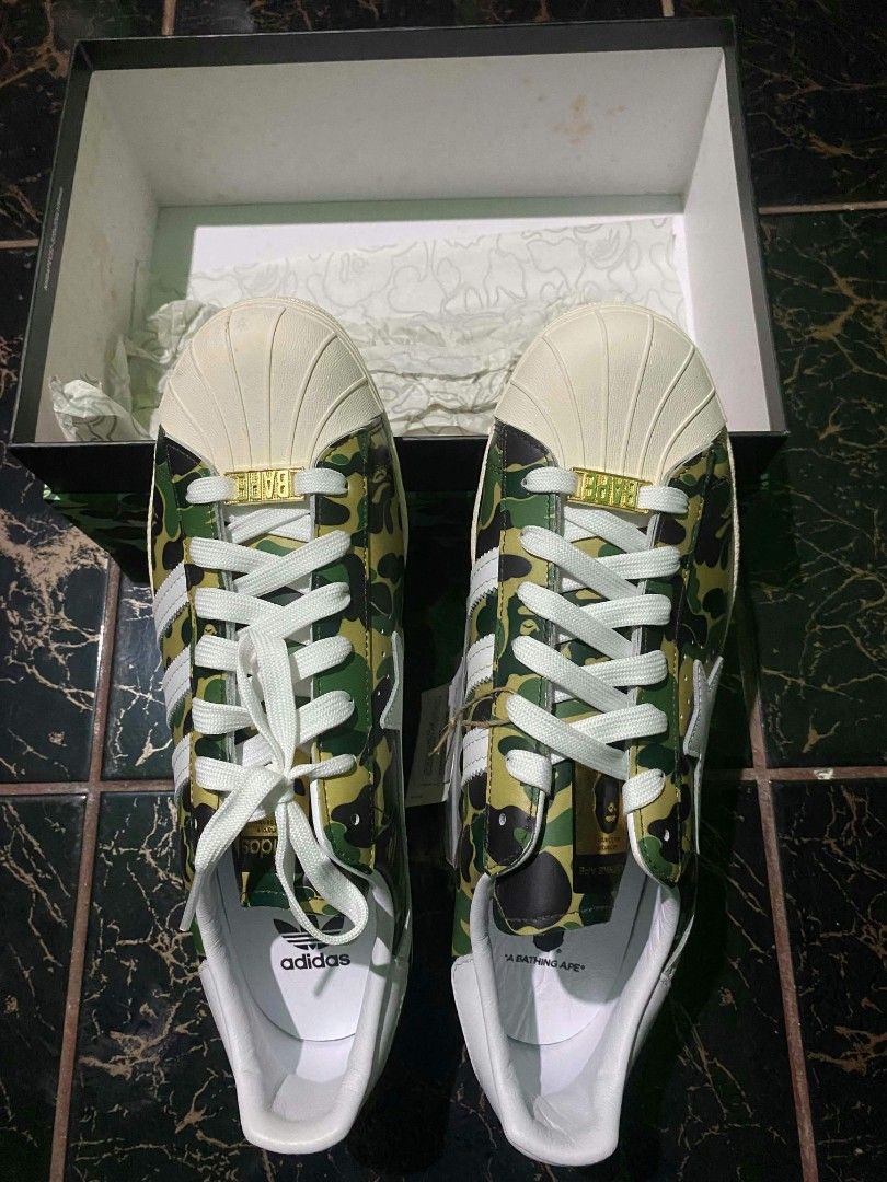 Adidas Superstar BAPE ABC Camo Green (Category: Sneakers) located in Quezon City. Submitted by ylang_ylang (Listing ID 1464900724, Image 3). Description: For sale only, not for swap. - 100% Authentic - Brand new, never used - Complete with: tags, receipt, extra laces, and original box - Crisp gold BAPE emblem as seen in photos - US 11.5 | UK 11 - Can send more photos upon request - Shipping fee c/o buyer - Payment via: GCash & bank transfer ‼️NEG