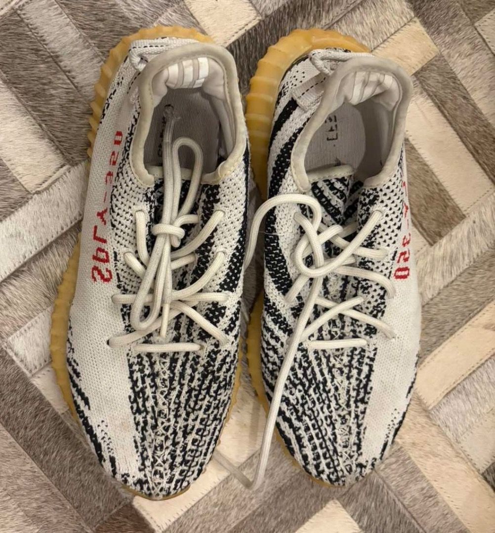 Adidas Yeezy Boost 350 V2 Zebra (Category: Sneakers) located in Quezon City. Submitted by ilabluxe (Listing ID 1464917952, Image 1). Description: - Model: Adidas Yeezy Boost 350 V2 Zebra - Colorway: White/Black with signature red SPLY-350 text - Comfort: Translucent gum rubber midsole with responsive Boost cushioning - Includes: Original laces - Condition: Normal wear on soles and upper, still lots of life left - Trusted seller: Buy with confiden