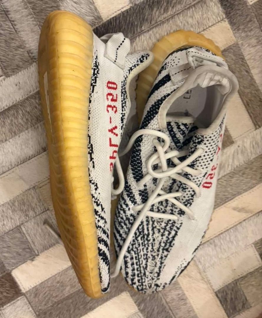 Adidas Yeezy Boost 350 V2 Zebra (Category: Sneakers) located in Quezon City. Submitted by ilabluxe (Listing ID 1464917952, Image 2). Description: - Model: Adidas Yeezy Boost 350 V2 Zebra - Colorway: White/Black with signature red SPLY-350 text - Comfort: Translucent gum rubber midsole with responsive Boost cushioning - Includes: Original laces - Condition: Normal wear on soles and upper, still lots of life left - Trusted seller: Buy with confiden