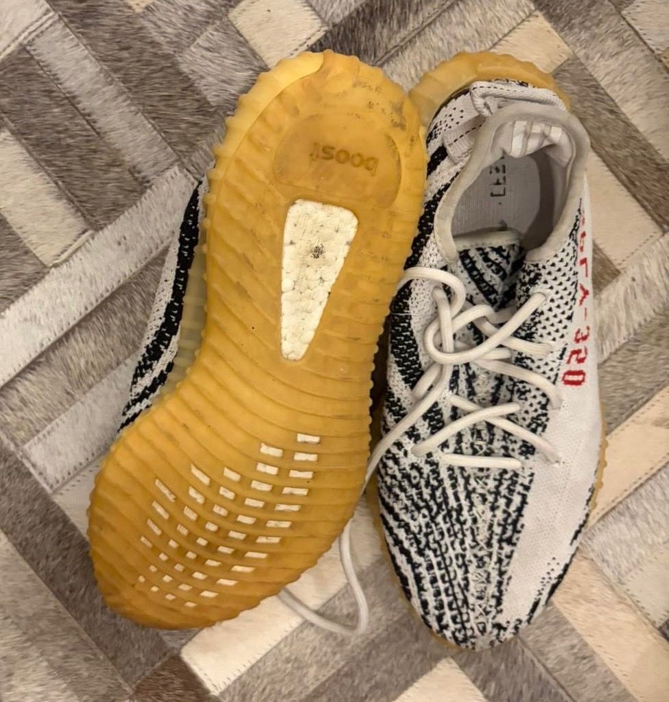 Adidas Yeezy Boost 350 V2 Zebra (Category: Sneakers) located in Quezon City. Submitted by ilabluxe (Listing ID 1464917952, Image 3). Description: - Model: Adidas Yeezy Boost 350 V2 Zebra - Colorway: White/Black with signature red SPLY-350 text - Comfort: Translucent gum rubber midsole with responsive Boost cushioning - Includes: Original laces - Condition: Normal wear on soles and upper, still lots of life left - Trusted seller: Buy with confiden