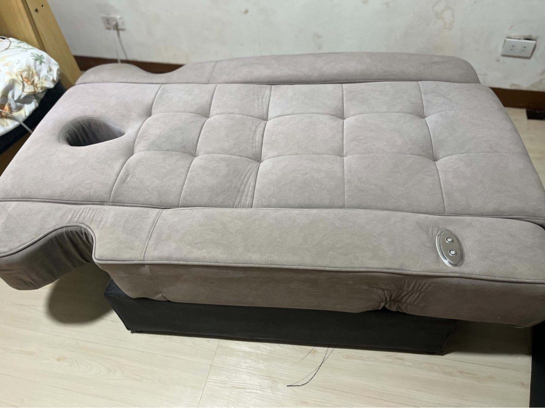Adjustable massage bed with face cradle and extension ottoman (Category: Bed Frames & Mattresses) located in Manila. Submitted by sharry24 (Listing ID 1464821368, Image 1). Description: - Color & Finish: Elegant tufted grey upholstery with a sturdy black base - Comfort & Design: Includes a built-in face hole at the headrest and a separate matching ottoman - Functionality: Convenient electric control buttons on the side for easy adjustments - Vers