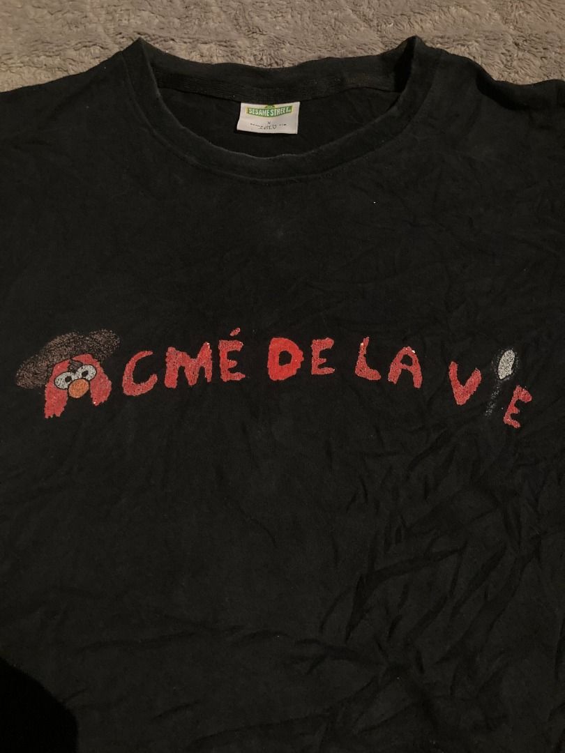 ADLV X SESAME STREET (Category: Luxury Apparel) located in Bulacan. Submitted by foundnfold (Listing ID 1464873046, Image 3). Description: ADLV Acmé De La Vie X SESAME STREET SIZE: LARGE WIDTH: 21 LENGTH: 27 ISSUE: Print shows minor signs of wear, BUT STILL WEARABLE COLOR RATE: 8/10 .