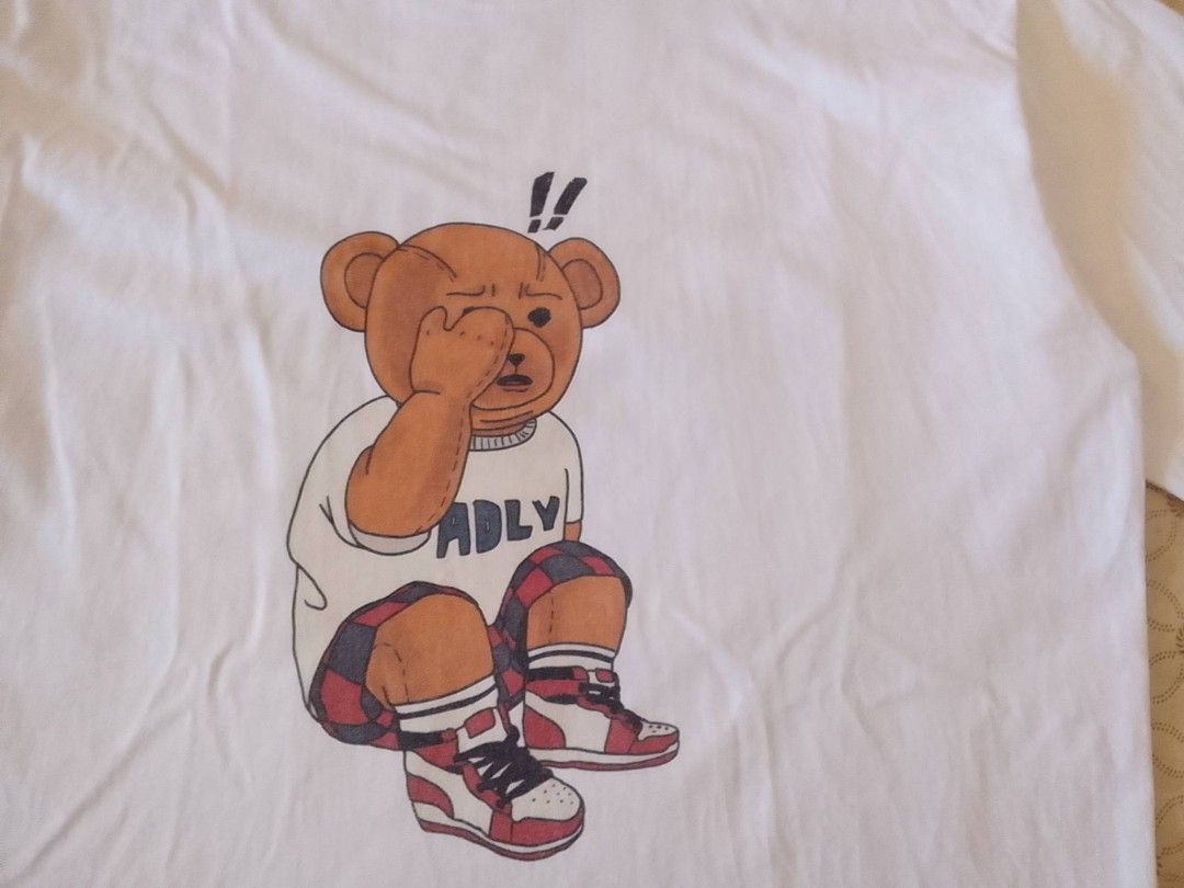 ADLV Bear T-Shirt White (Category: Tshirts & Polo Shirts ) located in Zamboanga. Submitted by nurbya898048 (Listing ID 1464923615, Image 2). Description: White t-shirt from ADLV. Graphic print on the front showing a bear holding its face, plus matching Tag size 1 Width 22 Length 29 In good condition Check all photos for details 550+shipping fee.