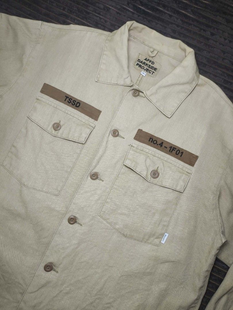 AFFD Darkside Project Utility Shirt Khaki Size L (Category: Tshirts & Polo Shirts ) located in Manila. Submitted by norathrifted (Listing ID 1464792318, Image 2). Description: - Brand/Model: AFFD Darkside Project - Size: Large - Color: Khaki - Material: Structured cotton - Closure: Button-front with matching brown buttons - Pockets: Two chest pockets with button flaps - Details: Printed lettering above both pockets, classic collar, and long sleev